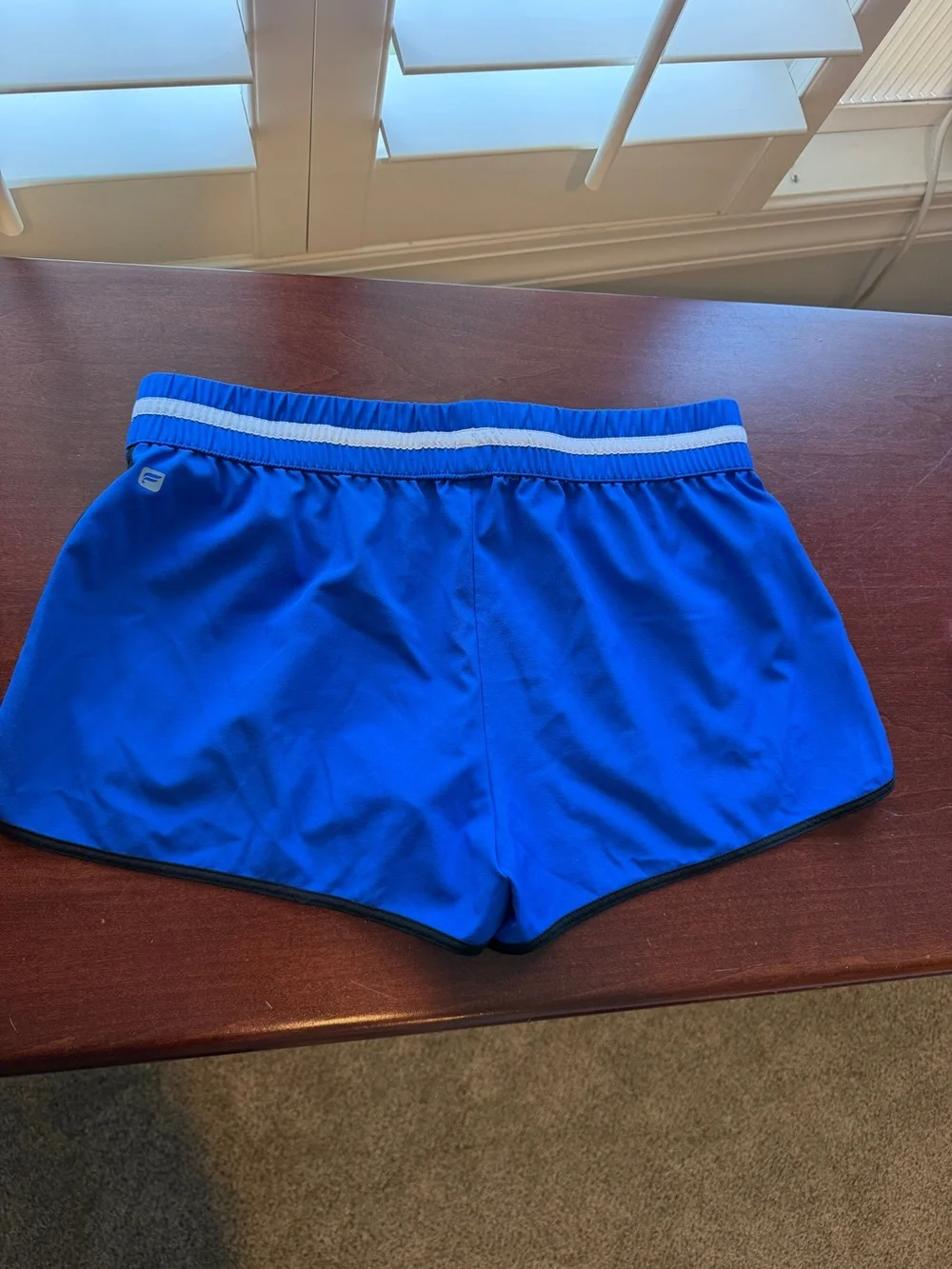 Fabletics Royal Blue Athletic Shorts with White Striped Waistband and Black Trim